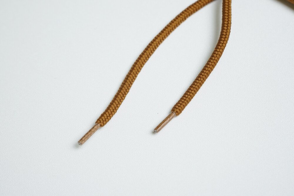 ベージュの「丸紐」