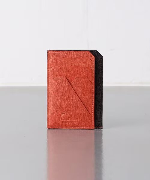 オレンジのバイカラーのミニ財布