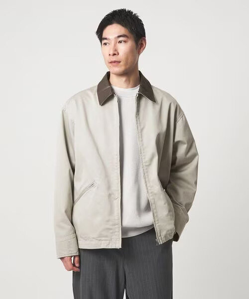 ブルゾンを羽織った男性