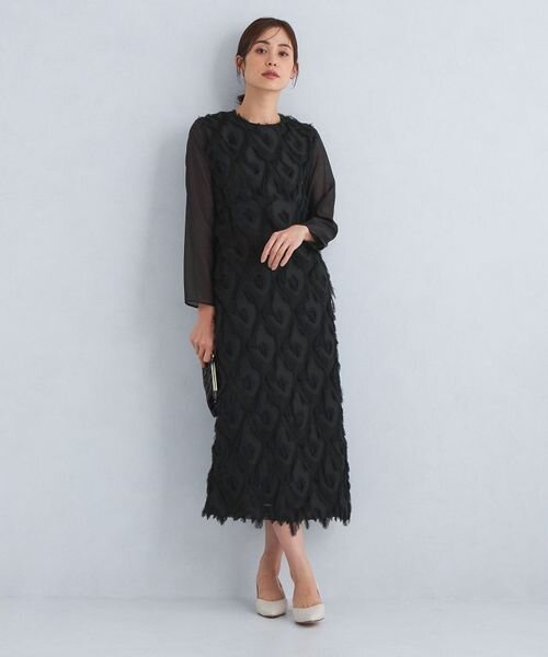 パンプスをはいた女性